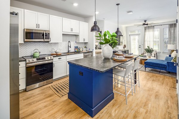 Modern kitchen with stainless steel appliances at NOVEL Harpeth Heights by Crescent Communities Apartments