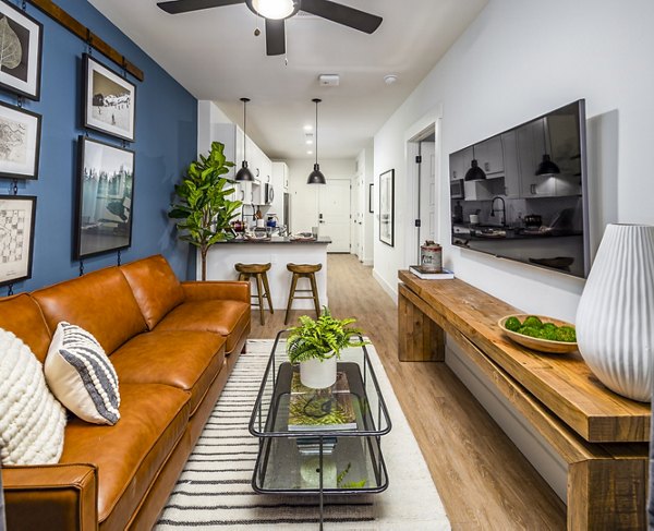 Spacious living room with stylish decor in NOVEL Harpeth Heights by Crescent Communities apartments