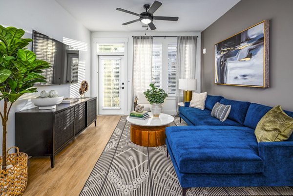 Spacious living room with modern decor at NOVEL Harpeth Heights by Crescent Communities apartments
