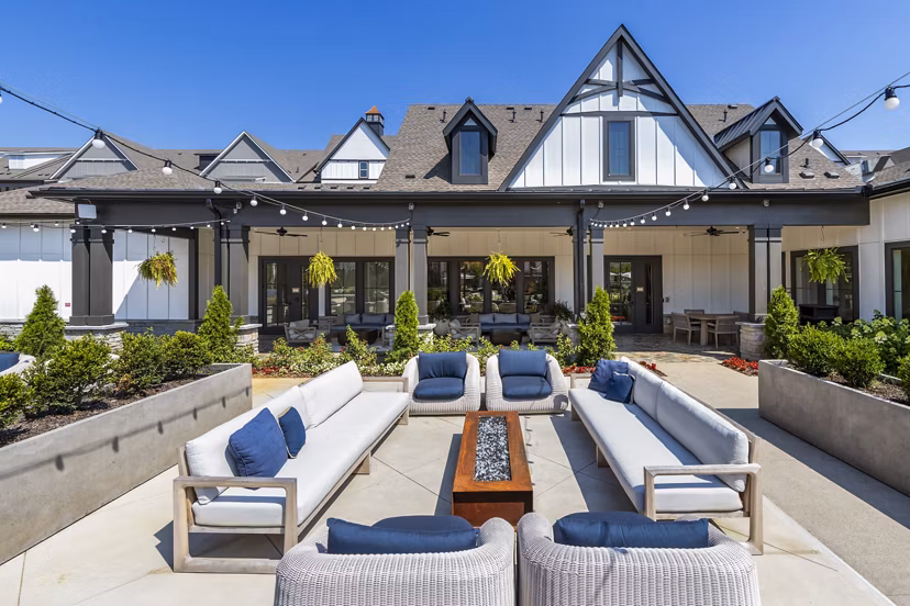 Patio at NOVEL Harpeth Heights: Cozy outdoor space with comfortable seating and greenery in luxury apartments by Crescent Communities