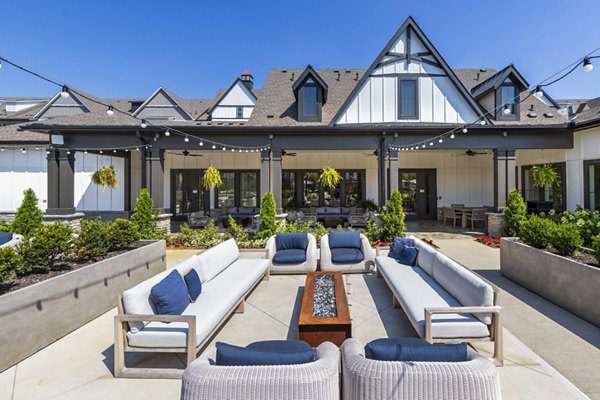 Patio at NOVEL Harpeth Heights: Cozy outdoor space with comfortable seating and greenery in luxury apartments by Crescent Communities