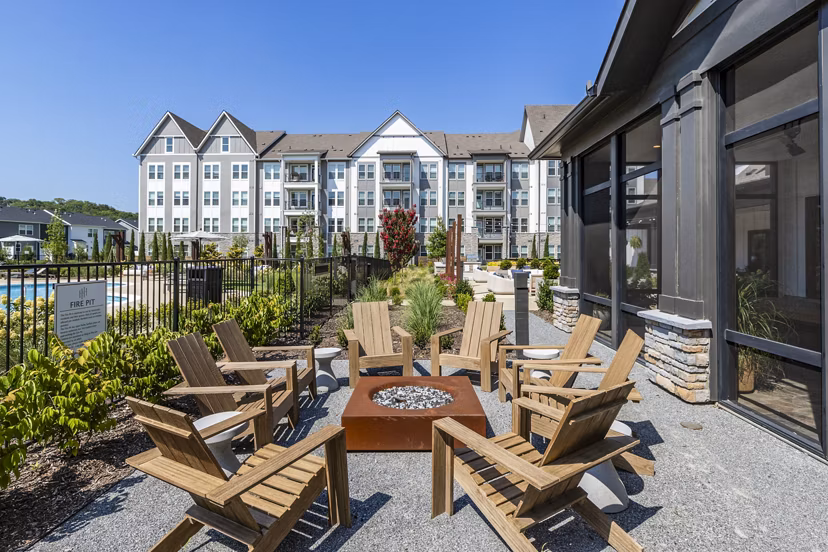 Cozy fire pit and spacious patio at NOVEL Harpeth Heights Apartments by Crescent Communities, ideal for outdoor gatherings and relaxation