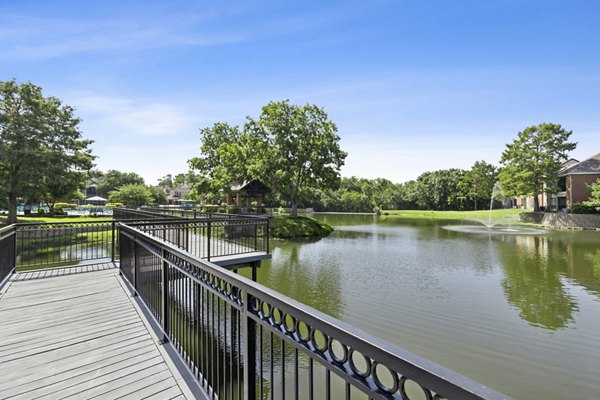 Patio featuring stylish outdoor seating and landscaping at Ashford Apartments, a luxury community by Greystar