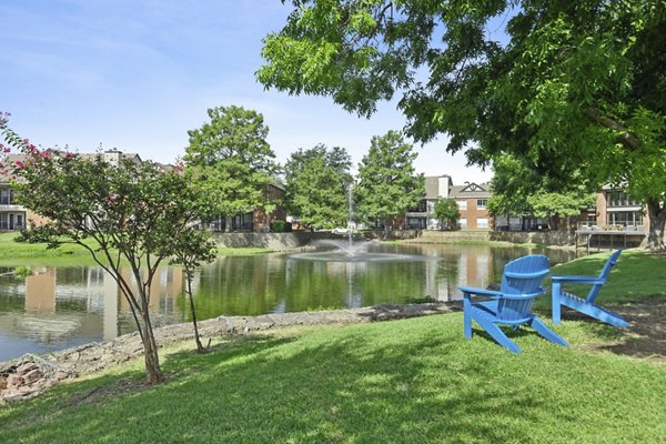 Inviting poolside with comfortable loungers at Ashford Apartments, a luxurious Greystar community