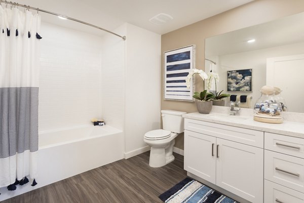 Modern bathroom with sleek fixtures and marble countertops at Kendry Apartments