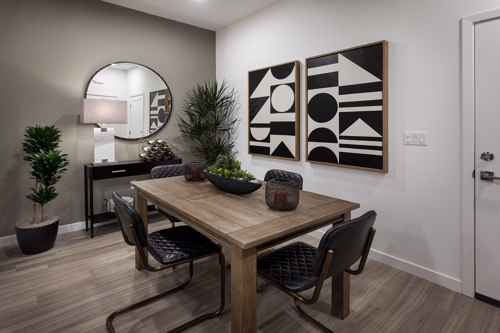 Dining room with elegant lighting and modern decor at Kendry Apartments