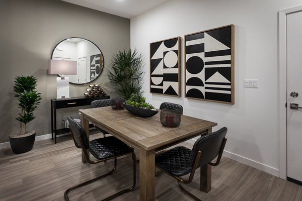 Dining room with elegant lighting and modern decor at Kendry Apartments
