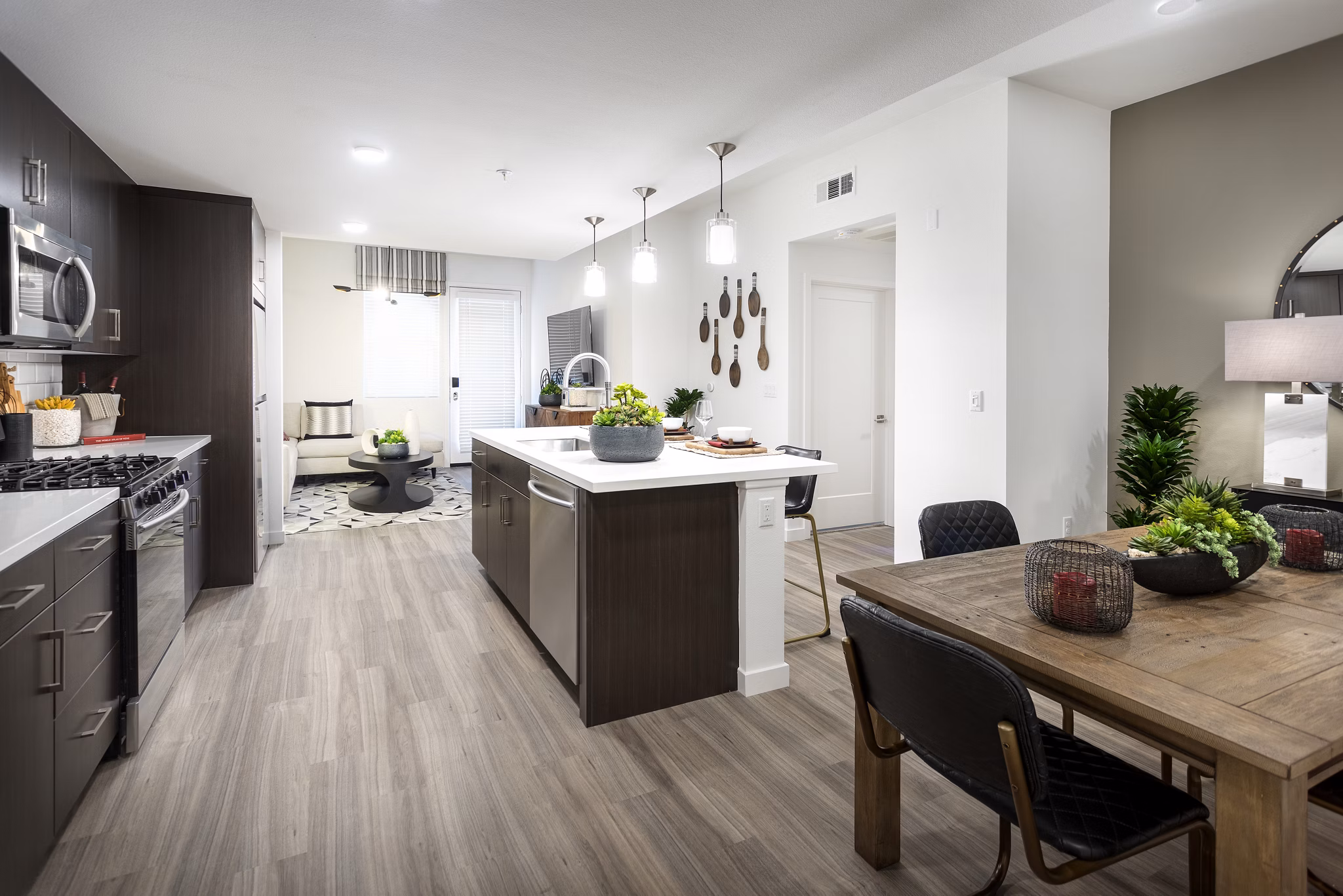 Elegant kitchen with stainless steel appliances and granite countertops at Kendry Apartments, a Greystar luxury property