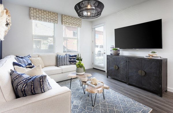 Living room with open floor plan and modern decor in Kendry Apartments
