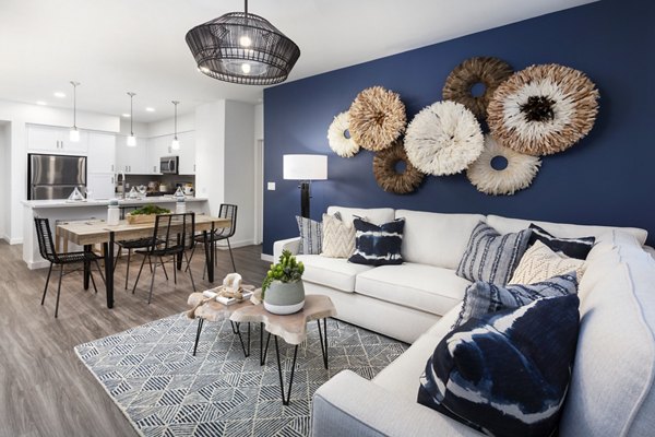 Elegant living room with modern furnishings in Kendry Apartments, featuring spacious layout and natural light