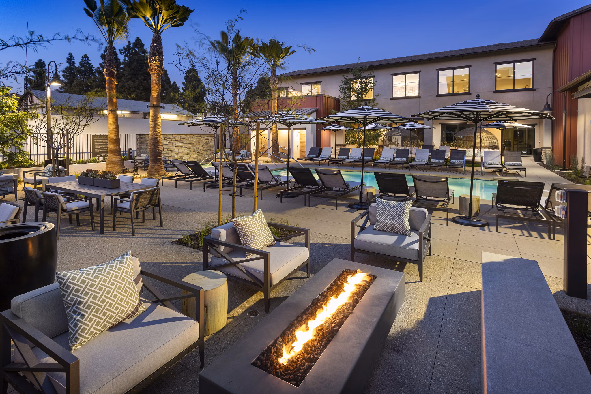 Resort-style pool with lounge chairs at Kendry Apartments, luxury living by Greystar