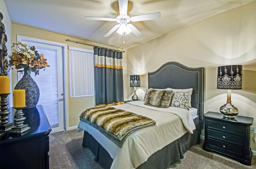 Cozy bedroom with modern furnishings at Ridgestone Apartments