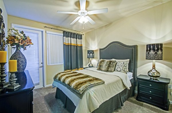 Cozy bedroom with modern furnishings at Ridgestone Apartments