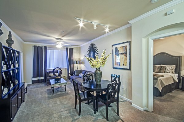 Dining room featuring elegant furnishings and modern lighting at Ridgestone Apartments