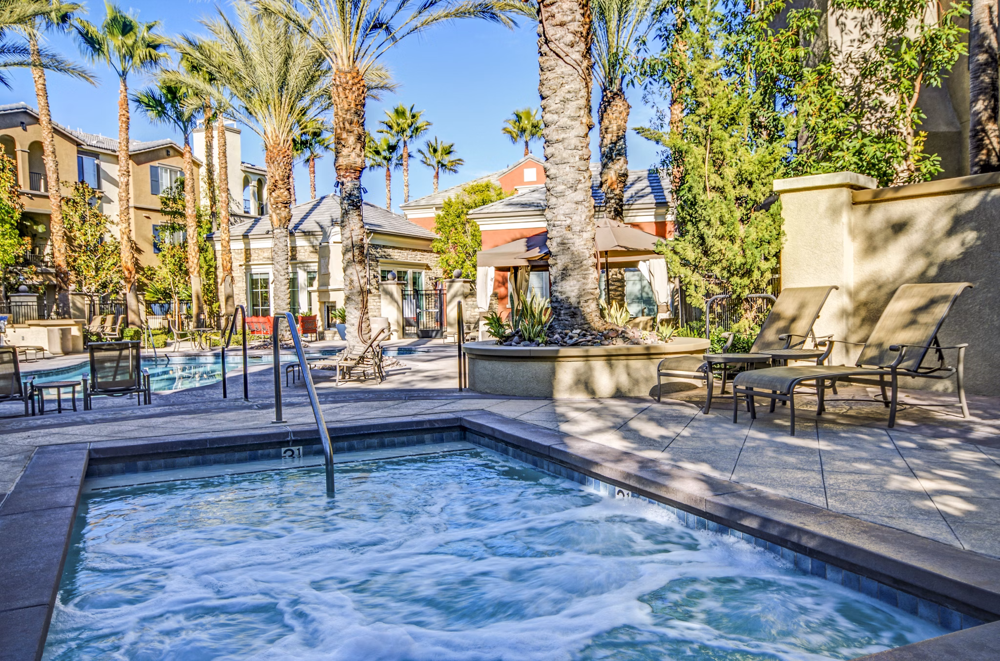Relaxing pool and hot tub area at Ridgestone Apartments, offering luxurious outdoor amenities for ultimate comfort