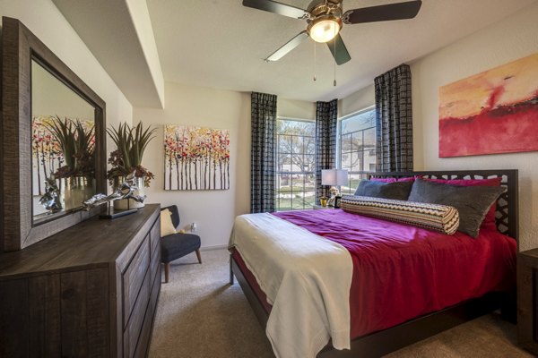 Cozy bedroom with modern decor at Solana Ridge Apartments, luxury living with comfort and style