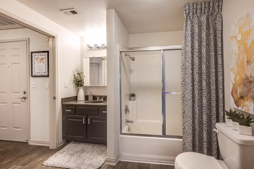 Bathroom featuring elegant marble countertops and modern fixtures at Solana Ridge Apartments