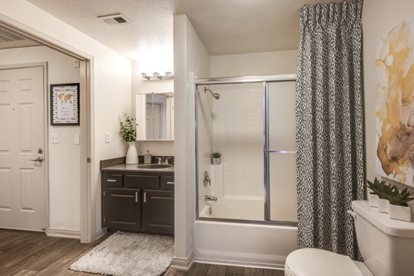 Bathroom featuring elegant marble countertops and modern fixtures at Solana Ridge Apartments