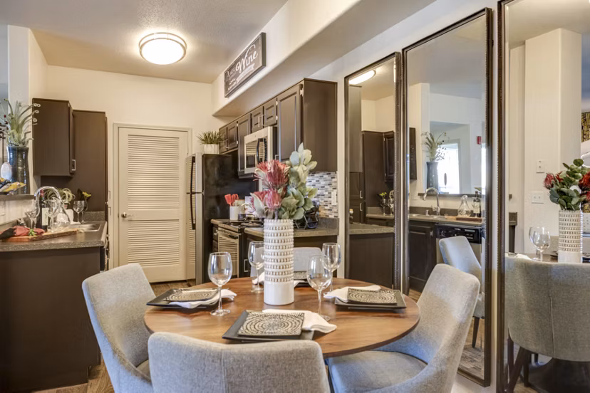 Elegant dining area with modern furnishings at Solana Ridge Apartments, showcasing stylish luxury living