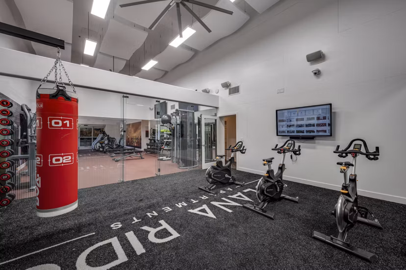 Yoga and spin studio at Solana Ridge Apartments: Fitness haven with modern equipment and spacious layout for a healthy lifestyle pursuit