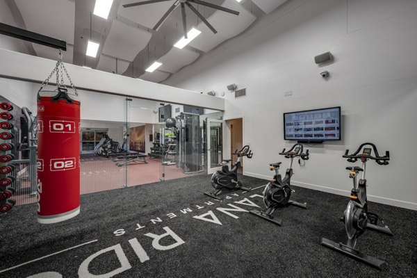 Yoga and spin studio at Solana Ridge Apartments: Fitness haven with modern equipment and spacious layout for a healthy lifestyle pursuit