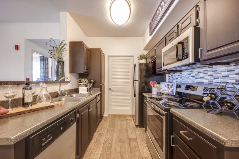 Modern kitchen with stainless steel appliances at Solana Ridge Apartments