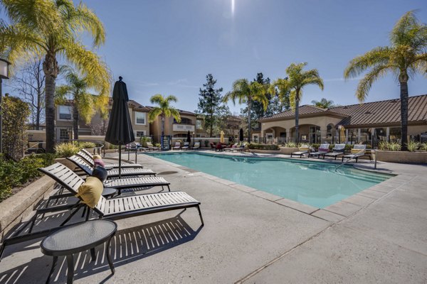 Resort-style pool with lounge chairs at Solana Ridge Apartments