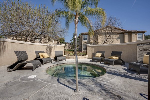 Hot tub relaxation area at Solana Ridge Apartments with scenic views and modern design