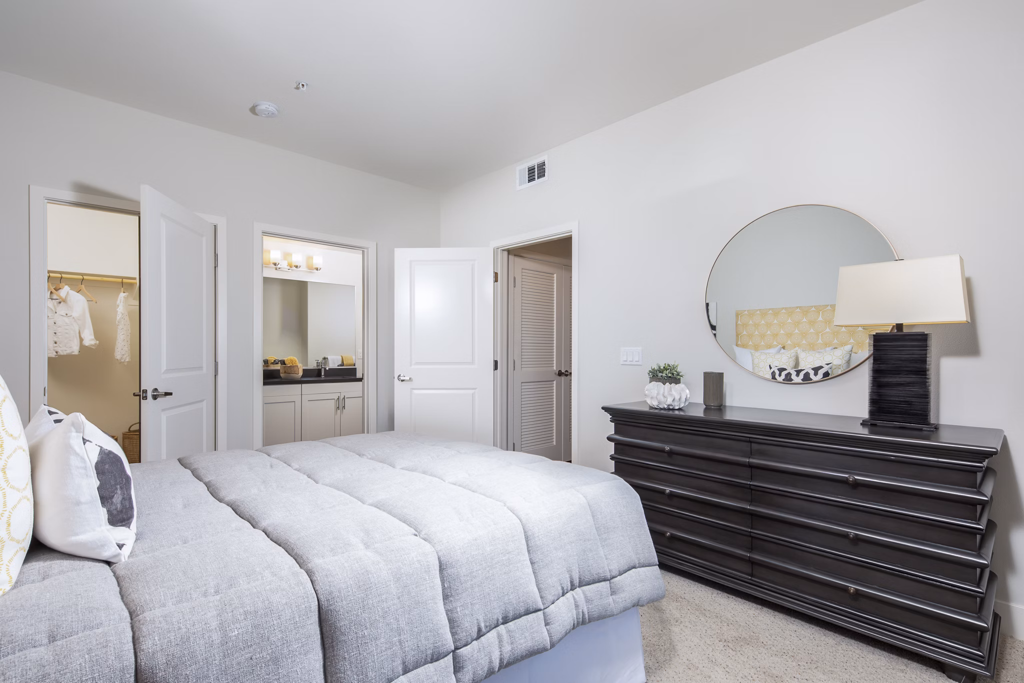 Bedroom offering modern design features at Sorano Apartments, luxury living with plush bedding and sleek furniture in a tranquil setting
