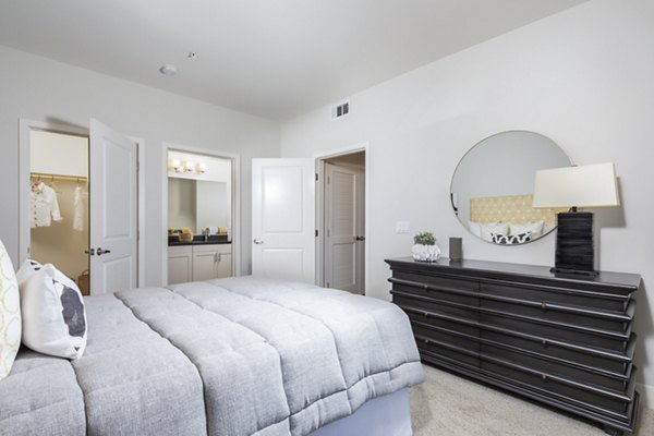 Bedroom offering modern design features at Sorano Apartments, luxury living with plush bedding and sleek furniture in a tranquil setting