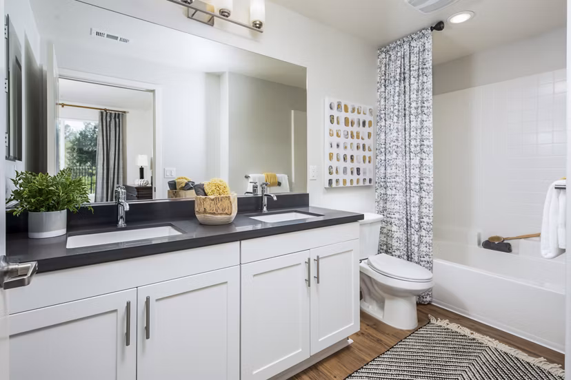 Bathroom featuring elegant fixtures and modern design at Sorano Apartments
