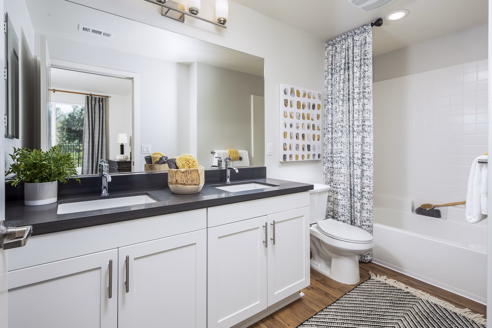 Bathroom featuring elegant fixtures and modern design at Sorano Apartments