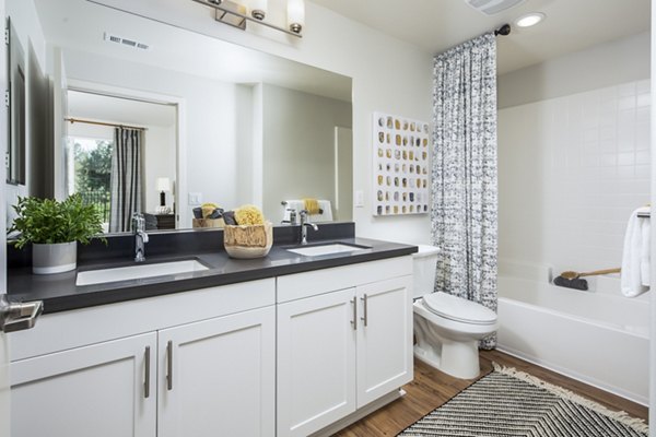 Bathroom featuring elegant fixtures and modern design at Sorano Apartments
