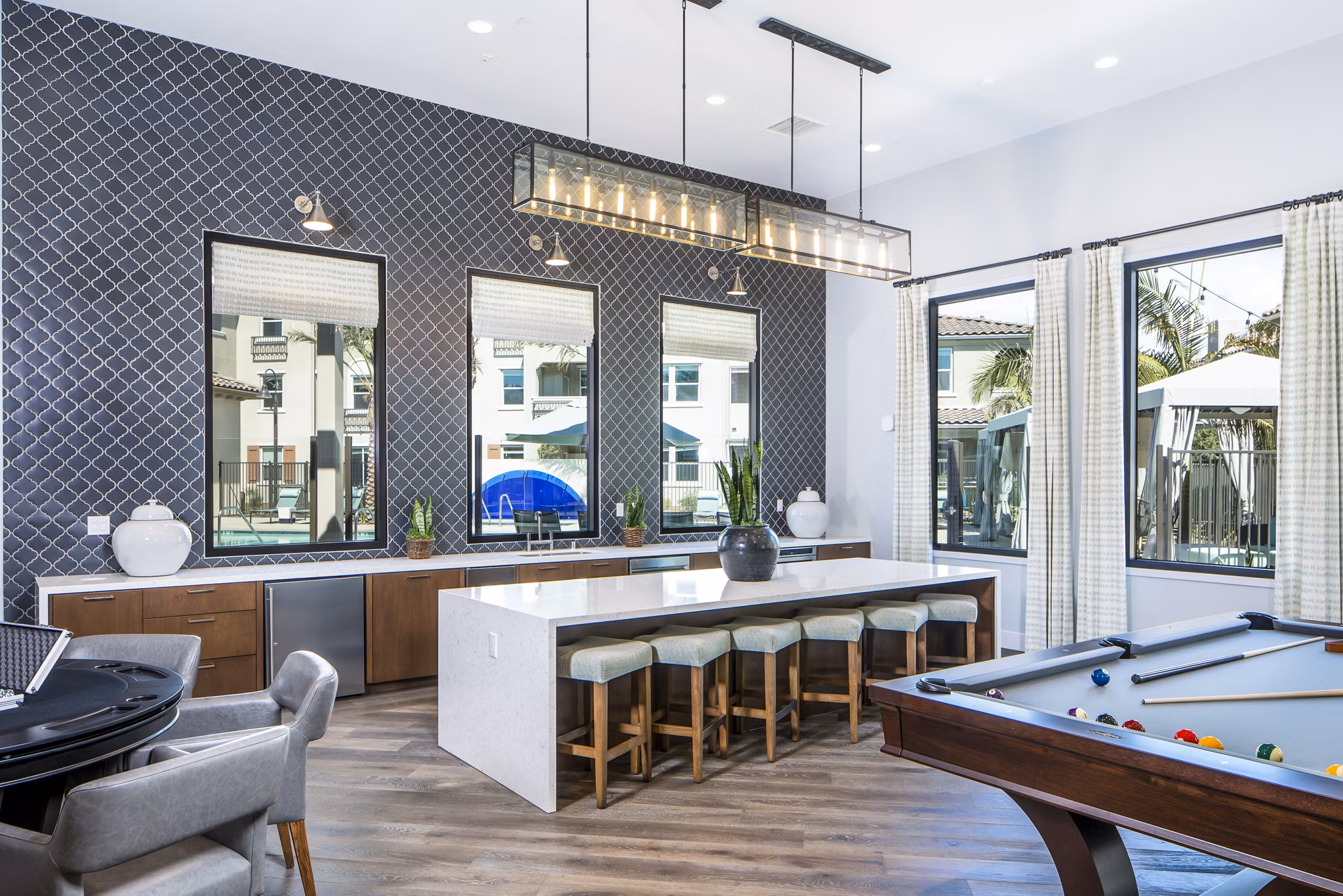 Sorano Apartments: Modern clubhouse kitchen with sleek countertops and stainless steel appliances