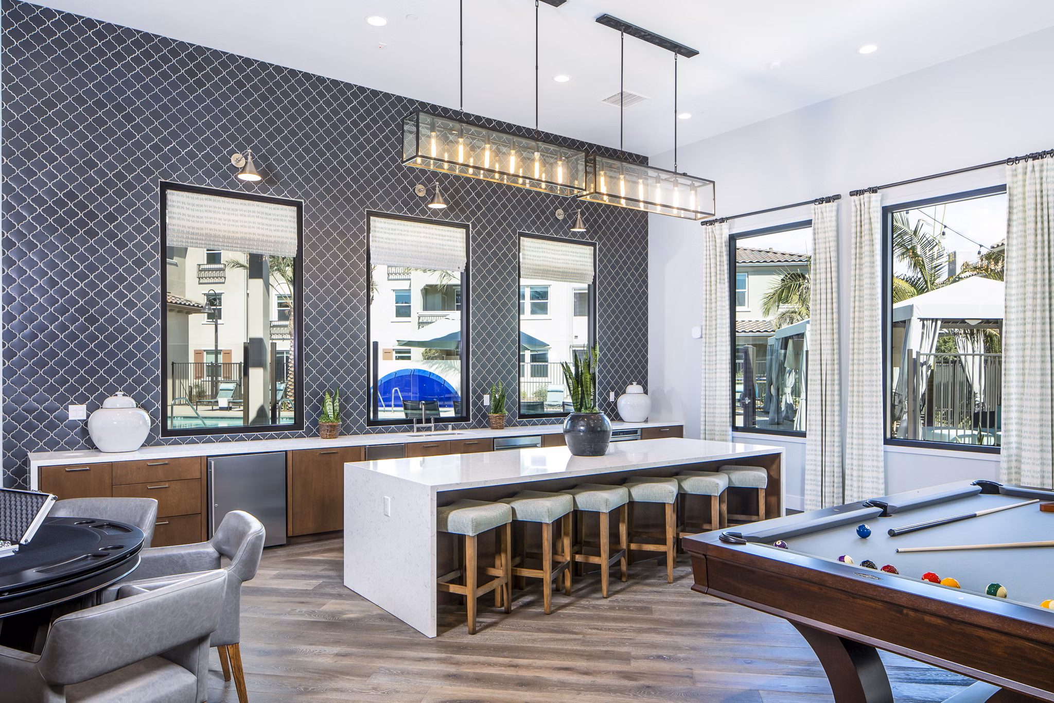 Sorano Apartments: Modern clubhouse kitchen with sleek countertops and stainless steel appliances