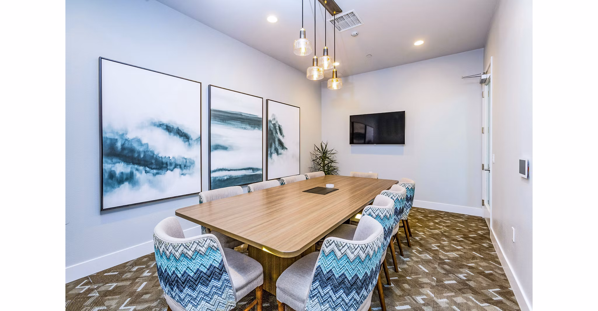 Meeting room for professional gatherings at Sorano Apartments with sleek design and ample seating options