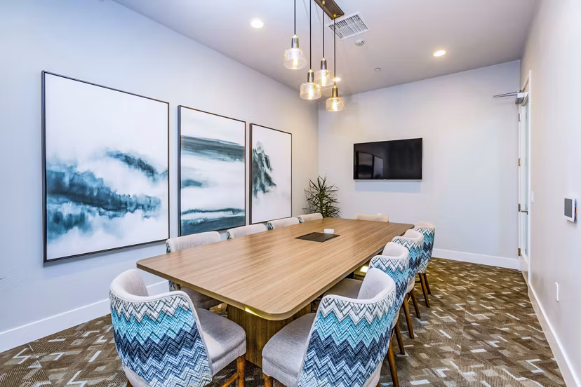 Meeting room for professional gatherings at Sorano Apartments with sleek design and ample seating options