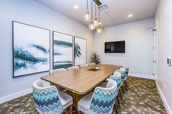 Meeting room for professional gatherings at Sorano Apartments with sleek design and ample seating options
