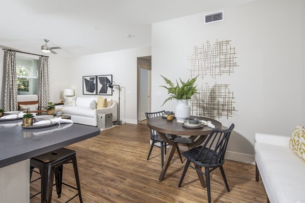 Dining room featuring elegant wooden furniture at Sorano Apartments