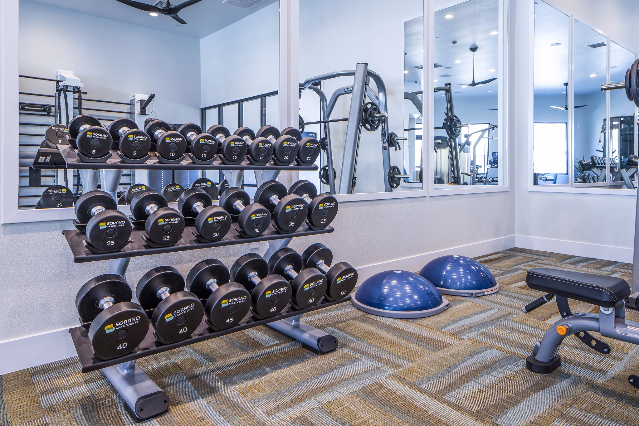 Modern fitness center with state-of-the-art equipment at Sorano Apartments