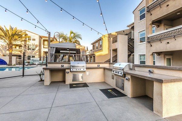 Outdoor grill area with modern amenities at Sorano Apartments, perfect for entertaining and dining under the open sky