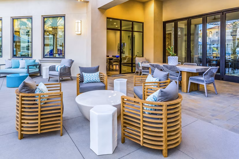 Outdoor patio with modern seating at Sorano Apartments, a luxury residential community