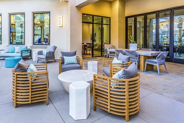 Outdoor patio with modern seating at Sorano Apartments, a luxury residential community
