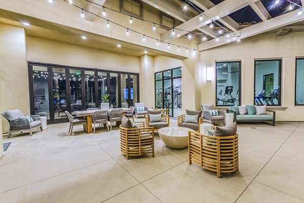 Patio with comfortable seating and decorative plants at Sorano Apartments
