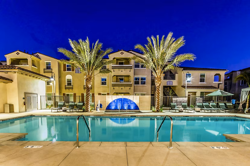 Modern pool with loungers at Sorano Apartments in luxurious setting
