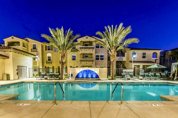Modern pool with loungers at Sorano Apartments in luxurious setting