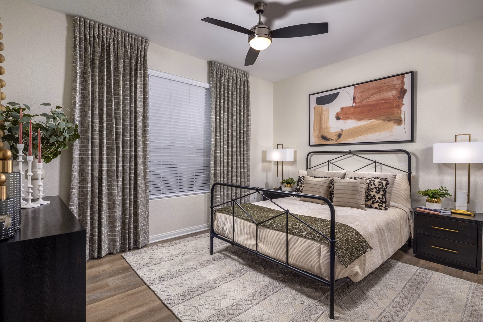 Cozy bedroom featuring modern furnishings and natural light at Tuscany Ridge Apartments