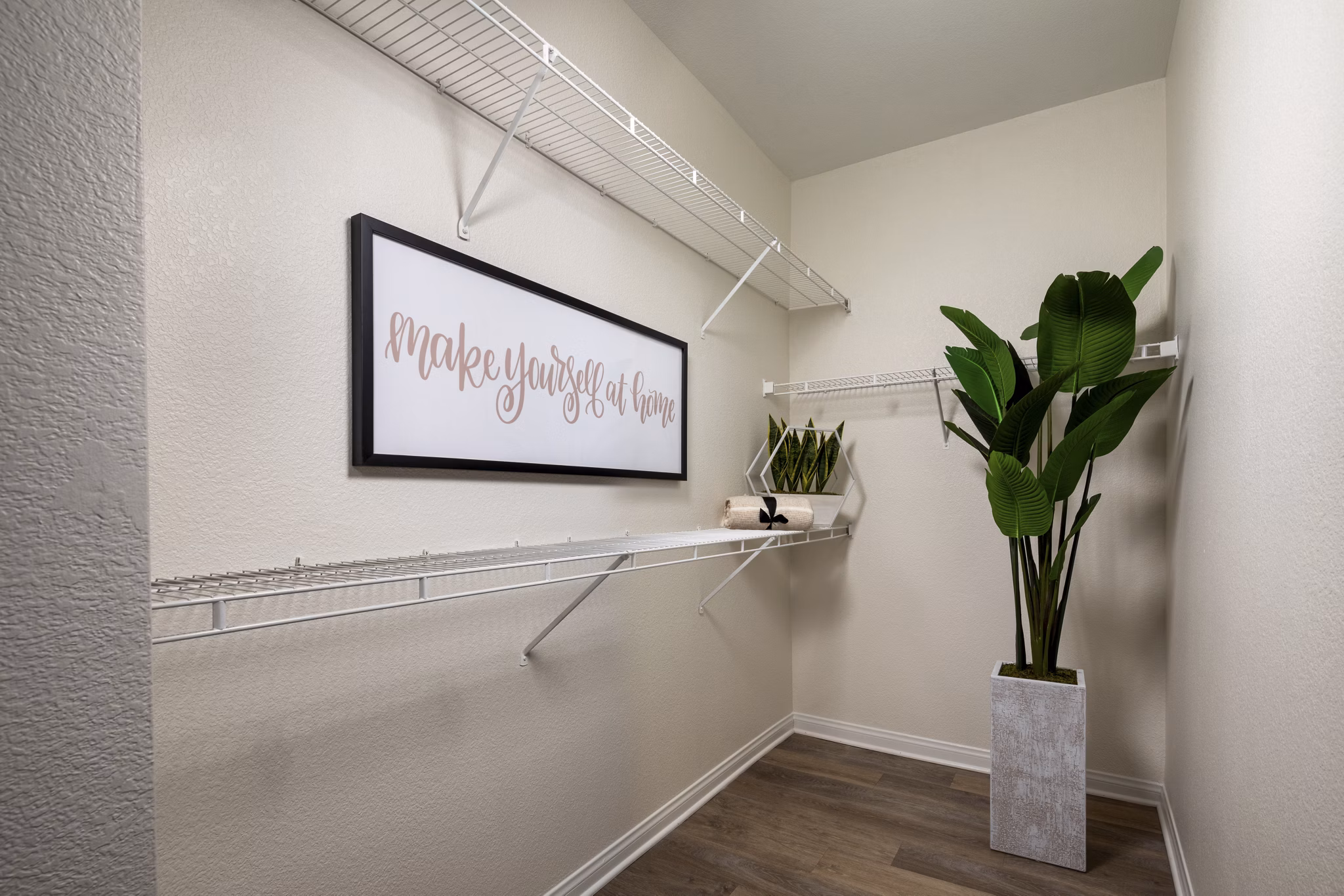 Tuscany Ridge Apartments: Walk-in closet with custom shelving and ample storage space