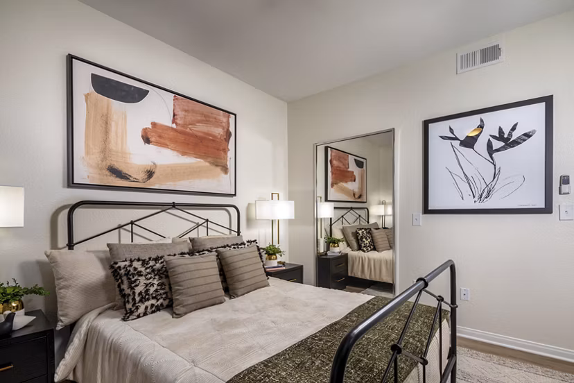 Cozy bedroom with stylish decor at Tuscany Ridge Apartments offering luxury living