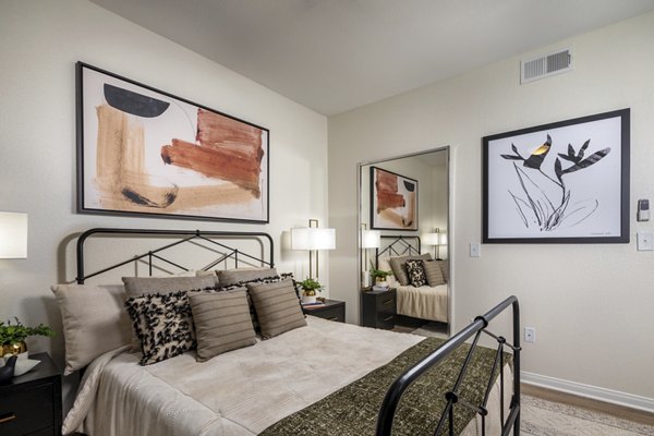 Cozy bedroom with stylish decor at Tuscany Ridge Apartments offering luxury living